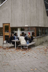 Young friends sitting together