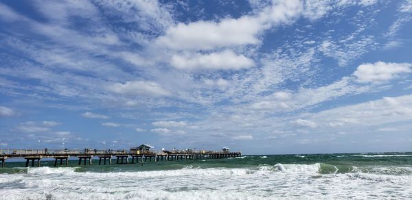 Pier over sea against sky