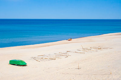 Scenic view of sea against clear blue sky