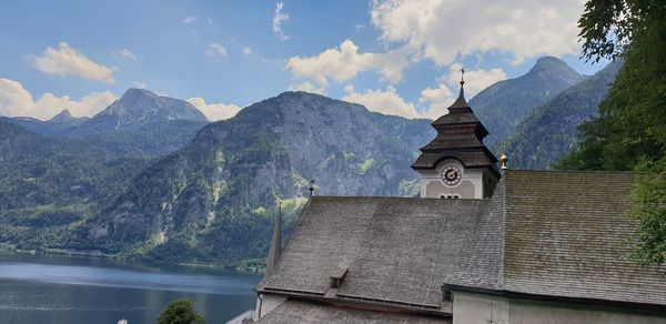 Panoramic shot of building and mountains against sky