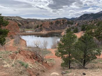 Scenic view of landscape against cloudy sky