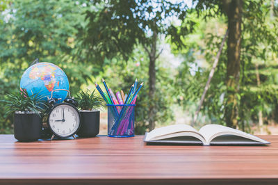 Table against blue sky and book