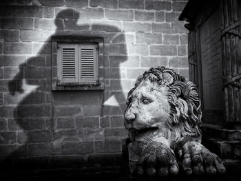 Close-up of statue against building