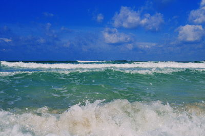 Scenic view of sea against blue sky