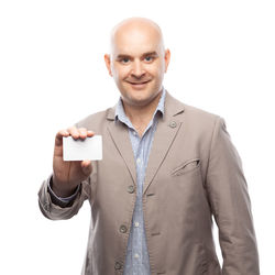 Portrait of smiling man standing against white background