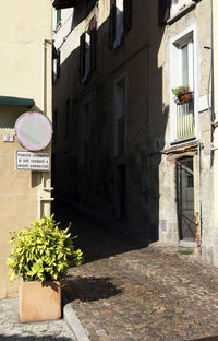 Narrow road along built structures