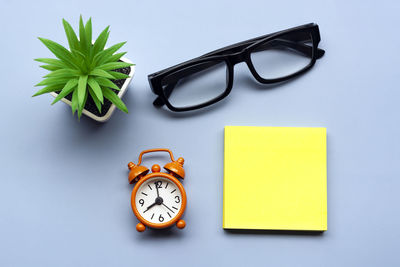 Directly above shot of alarm clock on table