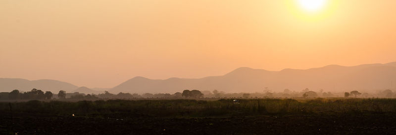 Scenic view of mountains at sunset