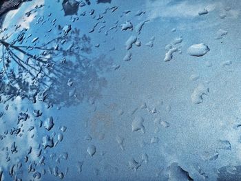 Sky reflection on wet windshield