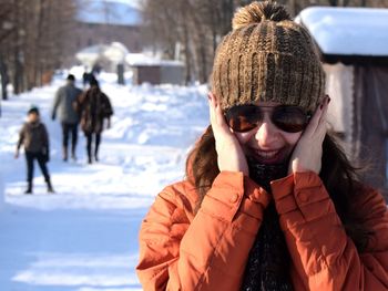 Close-up of man with ice cream in winter