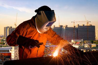 Man working at sunset
