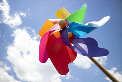 Low angle view of toys against blue sky