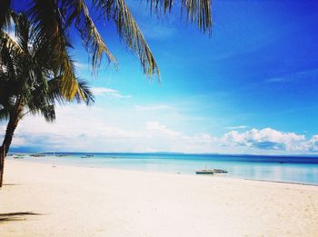 Scenic view of sea against blue sky