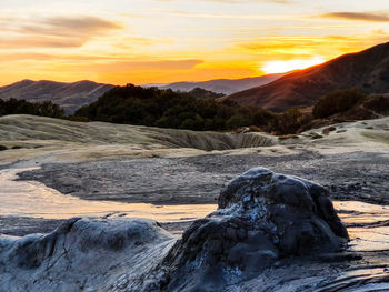 Scenic view of mountains against sky during sunset