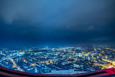 High angle view of illuminated buildings in city at night