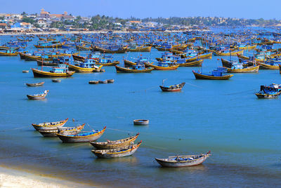 Boats moored in calm sea