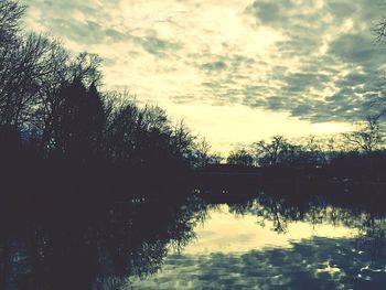 Scenic view of lake against cloudy sky