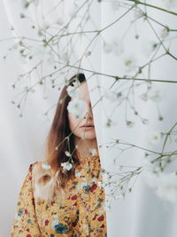 Woman standing by plants