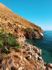 Scenic view of sea against clear blue sky