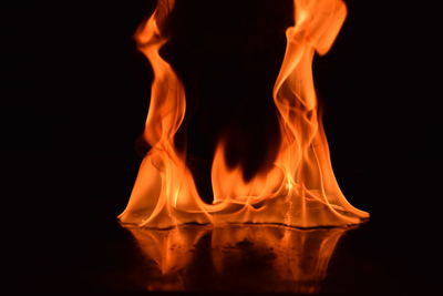 Close-up of bonfire against black background