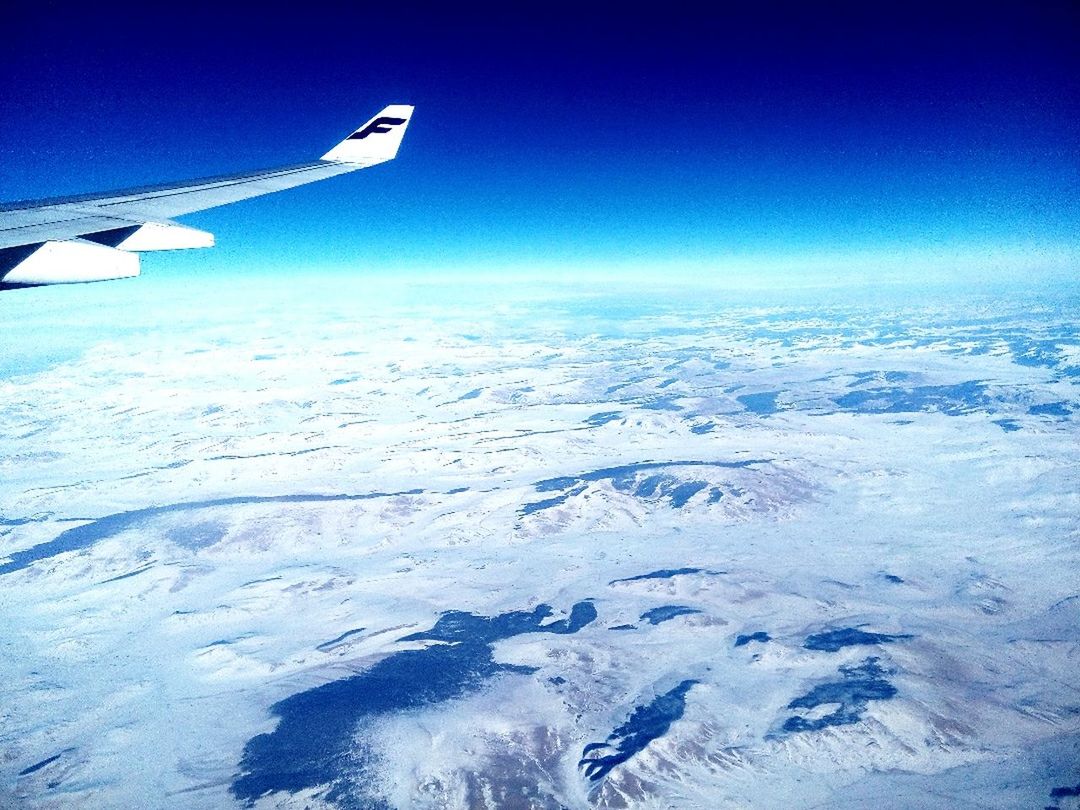 snow, winter, cold temperature, blue, snowcapped mountain, season, landscape, scenics, mountain, beauty in nature, tranquil scene, air vehicle, flying, airplane, nature, tranquility, sky, transportation, aircraft wing, weather