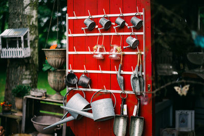 Close-up of red bell hanging on building