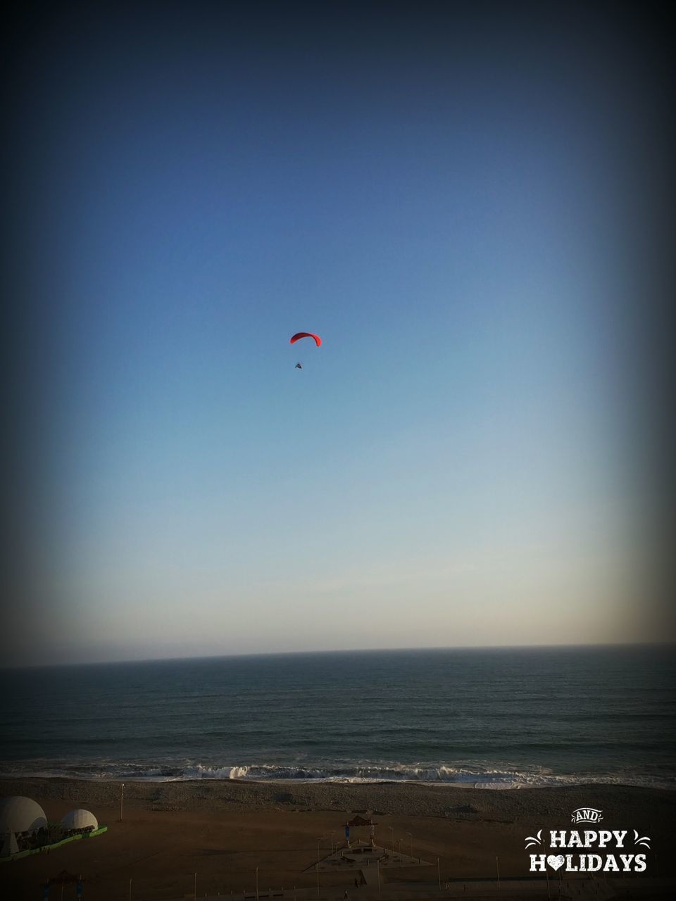 sea, horizon over water, beach, sky, water, nature, outdoors, paragliding, beauty in nature, parachute, day, parasailing, no people