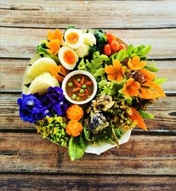 High angle view of various flowers in bowl on table