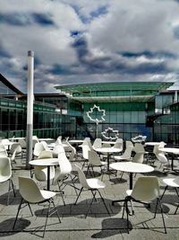 Chairs and table against sky