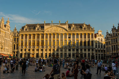 Group of people in front of buildings