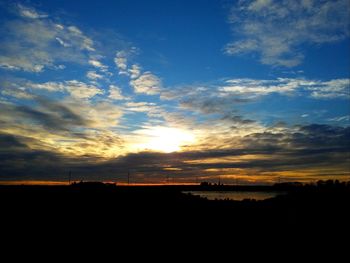 Scenic view of silhouette landscape against sky during sunset