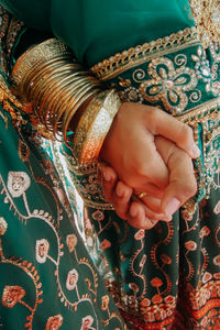 Close-up of woman and man hand