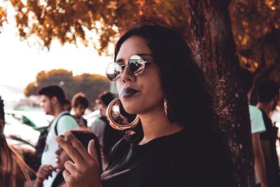 Portrait of happy young woman outdoors