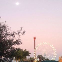 Low angle view of ferris wheel against sky