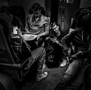 High angle view of people sitting in train