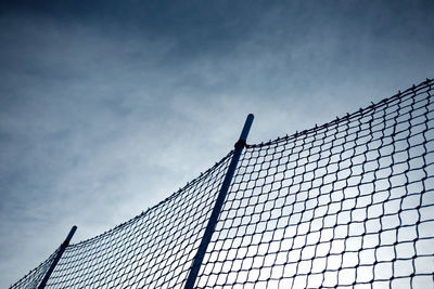 Net fence view against the sky