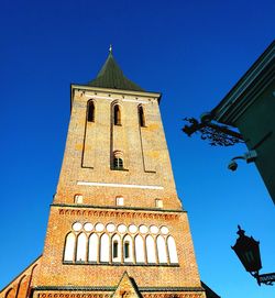 Low angle view of church against blue sky