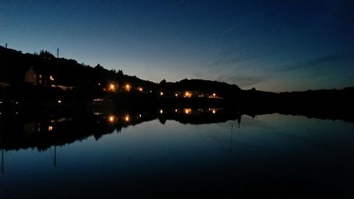 Reflection of trees in water at night