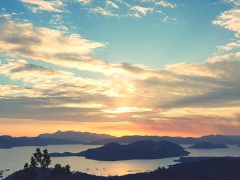 Scenic view of silhouette mountains against sky at sunset