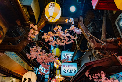 Low angle view of illuminated lanterns for sale in market