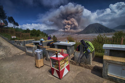 View of picnic area against volcanic landscape