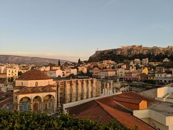 Buildings in town against clear sky