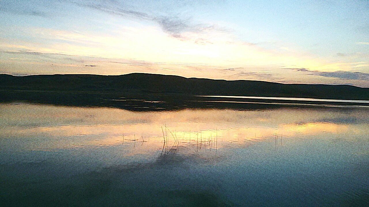 sunset, tranquil scene, water, tranquility, scenics, sky, beauty in nature, mountain, reflection, cloud - sky, nature, idyllic, lake, cloud, sea, landscape, non-urban scene, sand, remote, mountain range