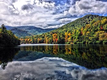 Scenic view of mountains against cloudy sky