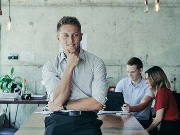 Portrait of a young man using phone