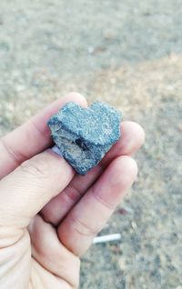 Close-up of hand holding heart shape