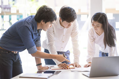 Group of people working on table