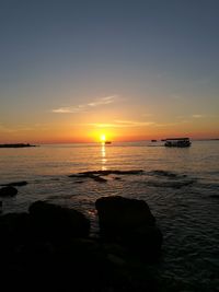 Scenic view of sea against sky during sunset