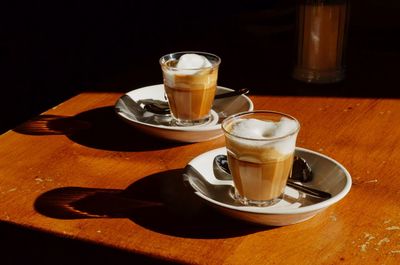 Close-up of coffee cups on table