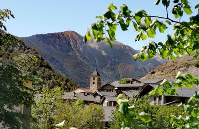 Buildings and mountains against sky